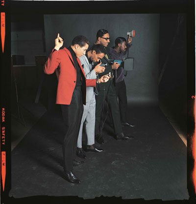 P105,-Smokey-Robinson-and-the-Miracles-turn-the-tables-during-a-photoshoot.-Courtesy-of-the-EMI-Archive-Trust-and-Universal-Music-Group.jpg